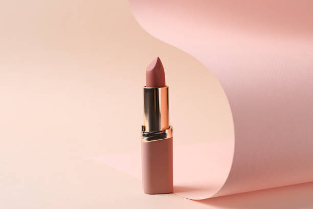 Beautiful lipstick on beige background